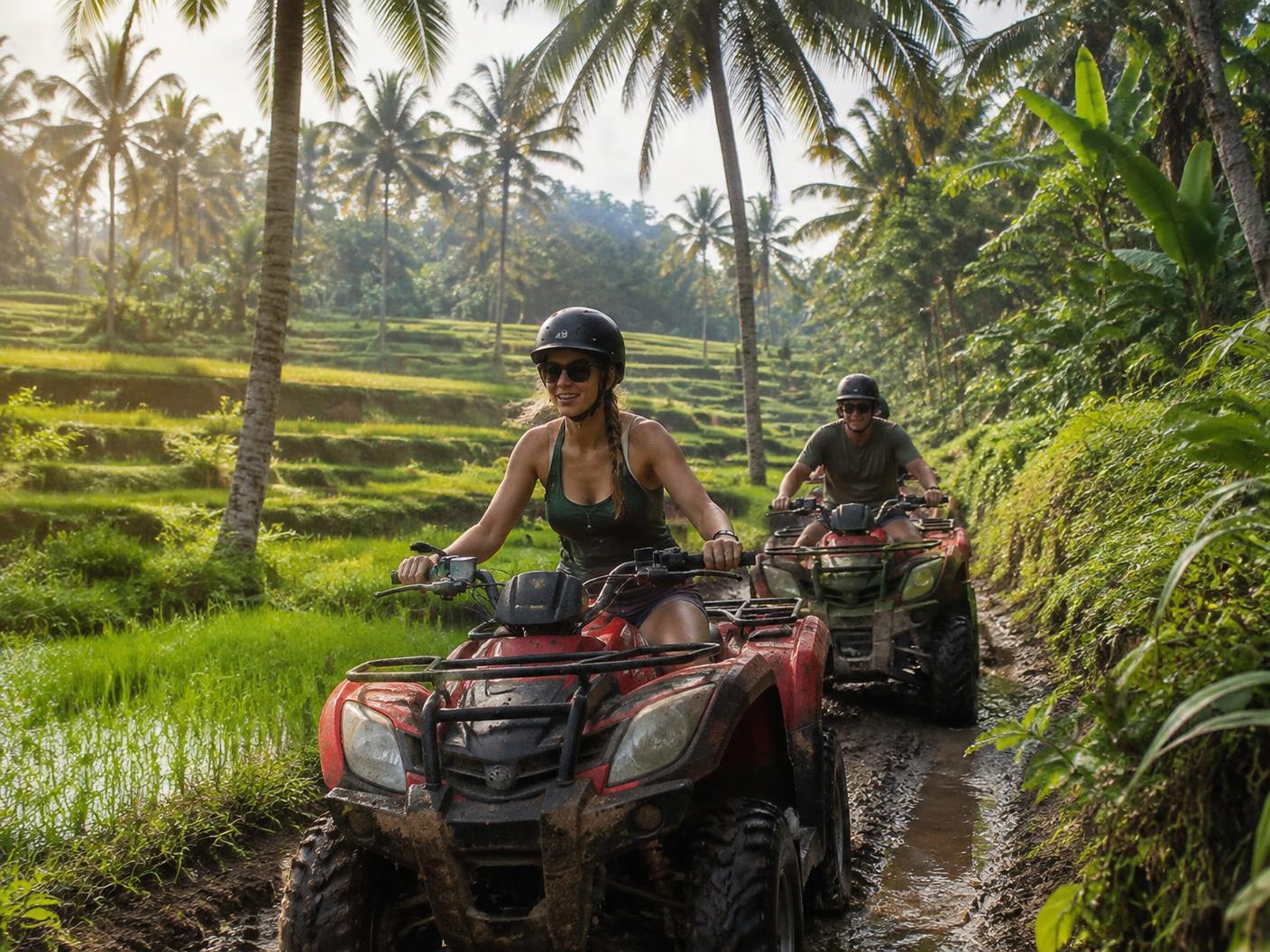 Quad bikes on a jungle trail beside rice terraces